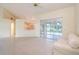 Open living room with tile floors, kitchen views and sliding glass doors to the outdoors at 2260 Nw 51St Ter, Ocala, FL 34482