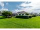 Single-story home with landscaped yard and screened enclosure at 2260 Nw 51St Ter, Ocala, FL 34482