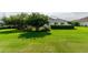 Spacious backyard with lush green grass and mature trees at 2260 Nw 51St Ter, Ocala, FL 34482