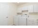 Laundry room with washer, dryer, and cabinets at 2260 Nw 51St Ter, Ocala, FL 34482