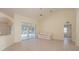 Spacious living room featuring tile floors and access to a relaxing patio at 2260 Nw 51St Ter, Ocala, FL 34482