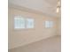 Spacious bedroom with ceiling fan, tile floors, and window shutters at 2260 Nw 51St Ter, Ocala, FL 34482