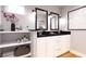 Modern bathroom with double vanity, dark countertops, and sleek lighting at Tbd Magnolia Place Dr, Ocklawaha, FL 32179