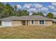 New single-story home with attached garage and neutral color scheme at 12789 Sw 86Th Cir, Ocala, FL 34473