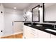 Modern bathroom with double vanity, dark countertops, and a walk-in shower at Tbd Guava Ln, Ocklawaha, FL 32179