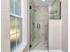 Modern bathroom with a glass shower and pebble floor at 19610 Sw 93Rd Pl, Dunnellon, FL 34432