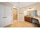 Main bathroom with walk-in shower and granite vanity at 16292 Sw 13Th Ter, Ocala, FL 34473