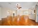 Living room featuring hardwood floors, an open layout, and access to other rooms at 16292 Sw 13Th Ter, Ocala, FL 34473