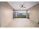 Screened porch with ceiling fan and view of backyard at 16292 Sw 13Th Ter, Ocala, FL 34473