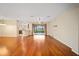 Spacious living room with hardwood floors and access to a patio at 16292 Sw 13Th Ter, Ocala, FL 34473