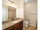 Bathroom with granite countertop and tiled floor at 16292 Sw 13Th Ter, Ocala, FL 34473