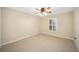 Bright bedroom with carpet flooring and ceiling fan at 16292 Sw 13Th Ter, Ocala, FL 34473
