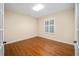 Spacious bedroom with hardwood floors and a window at 16292 Sw 13Th Ter, Ocala, FL 34473