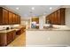 Well-equipped kitchen featuring wood cabinets and granite counters at 16292 Sw 13Th Ter, Ocala, FL 34473