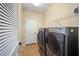 Laundry room with washer, dryer, and shelving at 16292 Sw 13Th Ter, Ocala, FL 34473