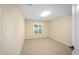 Well-lit bedroom with carpet flooring and window at 16292 Sw 13Th Ter, Ocala, FL 34473