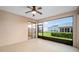 Bright screened porch with backyard view and sliding glass doors at 16292 Sw 13Th Ter, Ocala, FL 34473