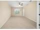 Primary bedroom with ceiling fan and carpet flooring at 16292 Sw 13Th Ter, Ocala, FL 34473