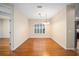 Simple dining room with hardwood floors and a light-filled window at 16292 Sw 13Th Ter, Ocala, FL 34473