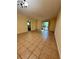 Spacious living room with tile flooring and access to a patio at 2851 Sw 32Nd Ave # 12, Ocala, FL 34474