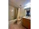 Clean bathroom with tub, toilet and wood vanity at 2851 Sw 32Nd Ave # 12, Ocala, FL 34474