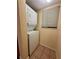 Laundry closet with stacked washer and dryer at 2851 Sw 32Nd Ave # 12, Ocala, FL 34474
