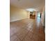 Open living area with tile floors and kitchen access at 2851 Sw 32Nd Ave # 12, Ocala, FL 34474