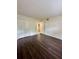 Primary bedroom with wood-look flooring and double closet at 2851 Sw 32Nd Ave # 12, Ocala, FL 34474
