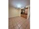 Dining area with tile floor and kitchen passthrough at 2851 Sw 32Nd Ave # 12, Ocala, FL 34474
