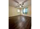 Spacious bedroom with wood-look flooring and ceiling fan at 2851 Sw 32Nd Ave # 12, Ocala, FL 34474