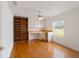 Home office with built-in desk and hardwood floors at 9372 Sw 90Th St, Ocala, FL 34481
