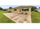 Home's back exterior with patio at 9372 Sw 90Th St, Ocala, FL 34481
