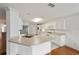 White kitchen with stainless steel appliances and breakfast bar at 9372 Sw 90Th St, Ocala, FL 34481