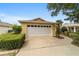 House exterior showcasing garage and driveway at 9372 Sw 90Th St, Ocala, FL 34481