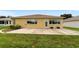 Home's back exterior and patio area at 9372 Sw 90Th St, Ocala, FL 34481
