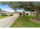 House exterior showcasing driveway and landscaping at 9372 Sw 90Th St, Ocala, FL 34481