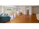 Hardwood-floor living room with a sofa and access to other rooms at 9372 Sw 90Th St, Ocala, FL 34481