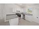 Modern kitchen with stainless steel appliances and grey countertops at 24449 Nw Falcon Ave, Dunnellon, FL 34431
