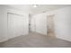 Bright bedroom with carpet flooring, double-door closet and private bathroom access at 24449 Nw Falcon Ave, Dunnellon, FL 34431