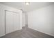 Well-lit bedroom featuring carpet floors and a large closet at 24449 Nw Falcon Ave, Dunnellon, FL 34431