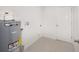 Laundry room with linoleum flooring and a new water heater at 24449 Nw Falcon Ave, Dunnellon, FL 34431