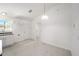 Eat-in kitchen with stainless steel appliances and light wood flooring at 24449 Nw Falcon Ave, Dunnellon, FL 34431