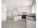 Modern kitchen with stainless steel appliances and a breakfast bar at 24449 Nw Falcon Ave, Dunnellon, FL 34431