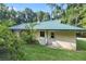 Rear view of the house showing a side entrance and AC unit at 7679 S Magnolia Ave, Ocala, FL 34476
