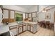 Kitchen with breakfast bar and adjacent dining area at 7679 S Magnolia Ave, Ocala, FL 34476