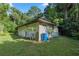 Attached two-car garage with a metal roof at 7679 S Magnolia Ave, Ocala, FL 34476