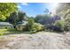 Aerial view showing a house with green metal roof and a large yard at 7679 S Magnolia Ave, Ocala, FL 34476
