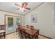 Cozy dining room with wooden table and access to the backyard at 7679 S Magnolia Ave, Ocala, FL 34476