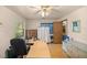 Bright office with desk, built-ins, and access to bathroom at 7679 S Magnolia Ave, Ocala, FL 34476