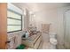Clean bathroom with shower/tub combo, vanity, and toilet at 7679 S Magnolia Ave, Ocala, FL 34476